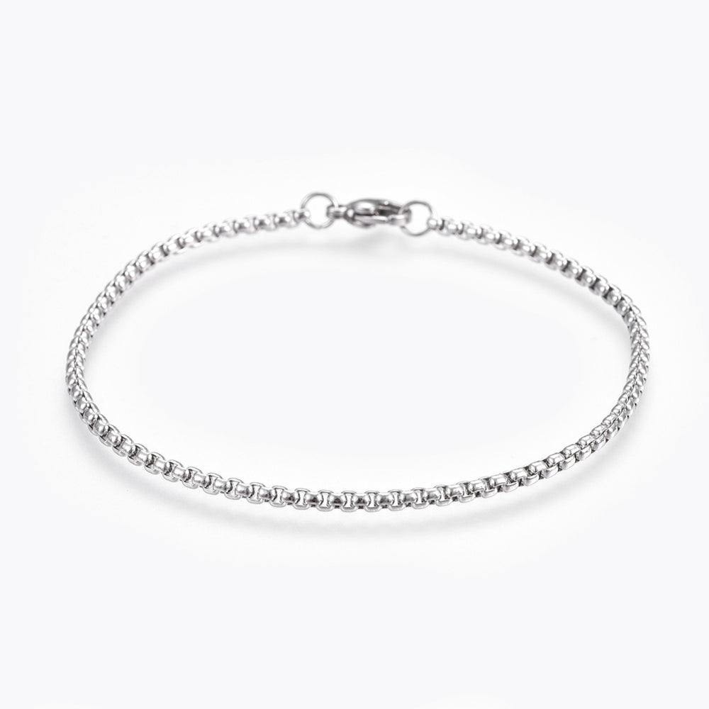 silver tone box chain bracelet with lobster claw class over white background. 