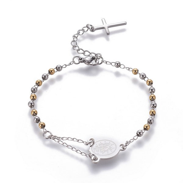 silver tone rosary bracelet with Virgin Mary connector piece a ball link chain with lobster claw claps and extender chain with a dangling cross charm over white background. 