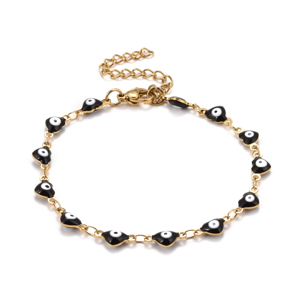 golden and black enamel heart shaped evil eye bracelet with lobster claw clasp and extender chain over white background.