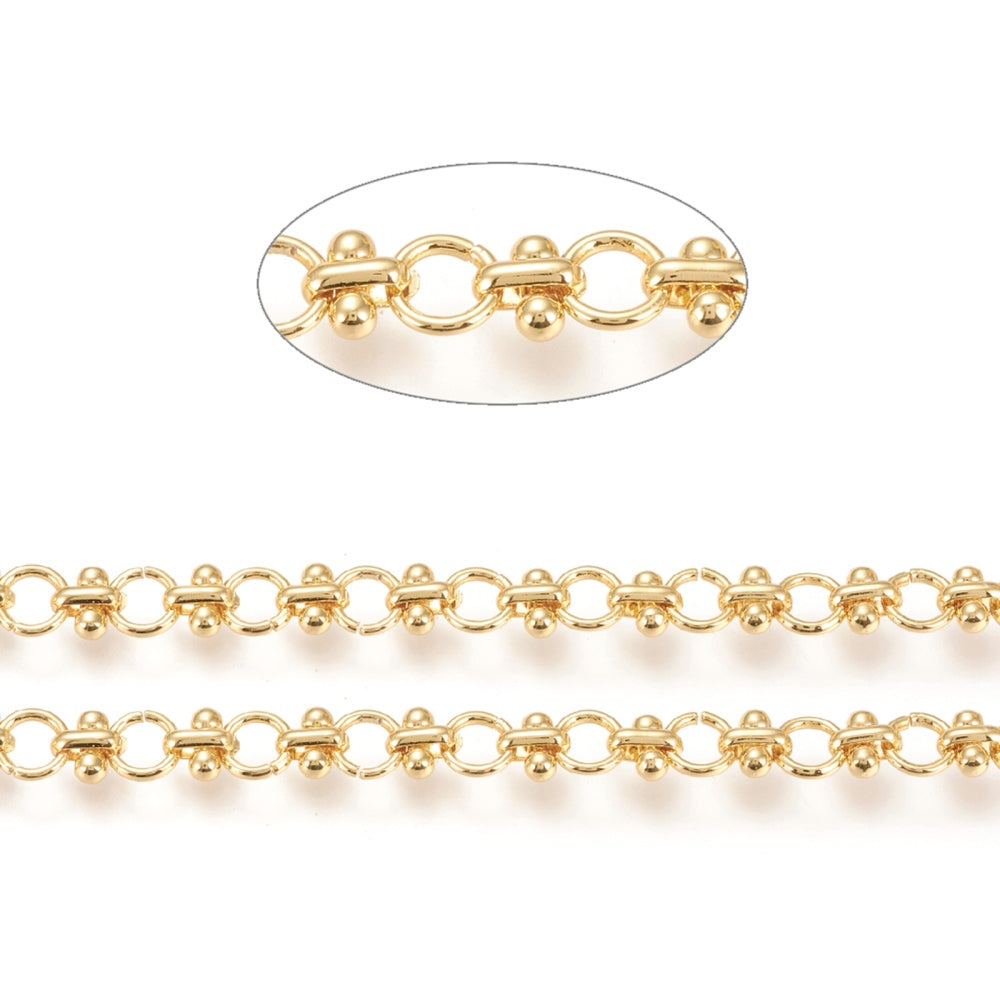 zoomed in sections of golden bar and circle link chain over white background. 