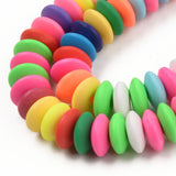 zoomed in sections of bright multicolor polymer clay saucer bead strands over white background. 