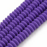 four purple polymer clay saucer bead strands over white background. 