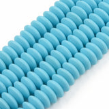 four turquoise polymer clay saucer bead strands over white background. 