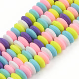 four pastel multicolor polymer clay saucer bead strands over white background. 