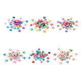 six piles in two rows of adorable colorful beads over white background. 