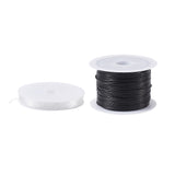 spools of elastic cord and black cord included in kit over white background. 