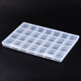 twenty-eight compartment clear plastic  bead storage container over black background. 