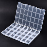 twenty-eight compartment clear plastic storage container open over black background. 