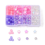 eight compartment plastic bead box containing pink and purple and clear beads like letters or hearts and stars and beads some loose examples below the box over white background. 