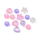 examples of some loose pink and purple and clear beads over white background. 