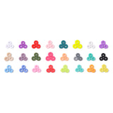 3 loose examples of all twenty-six colorful polymer clay disc beads over white background.