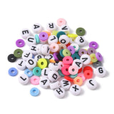 pile of variety of colors and letter beads contained in this bead kit over white background .