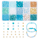 fifteen compartment plastic blue bead box with variety of blue and gold beads and some displayed loose and on a bracelet below over white background. 