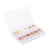 clear plastic bead storage bin containing a variety of metal and acrylic beads including the alphabet beads over white background. 