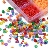 corner of rainbow bead box with an explosion of loose beads displaying the great variety of beads contained on a white surface. 