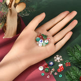 examples of a variety of Christmas-themed charms and beads in a mannequin hand and some on the red and green surface below. 