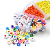 side of a rainbow shaped bead box  with a pile displaying the variety of beads over white background. 