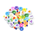 collection of colorful beads displaying the variety contained with the rainbow bead box over white background. 