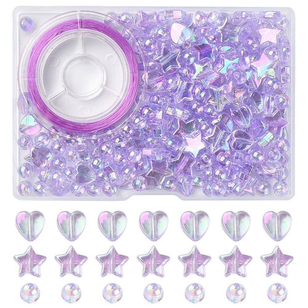 plastic bead box with iridescent light purple transparent beads and spool of purple stretch cord with examples of heart and start and round loose beads over white background. 