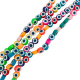 four multicolor polymer clay round eye bead strands over white background. 