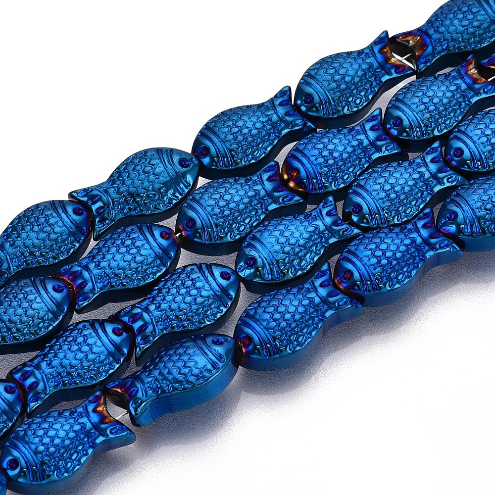 four strands of blue electroplate glass fish beads over white surface. 