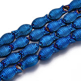 four strands of blue electroplate glass fish beads over white surface. 