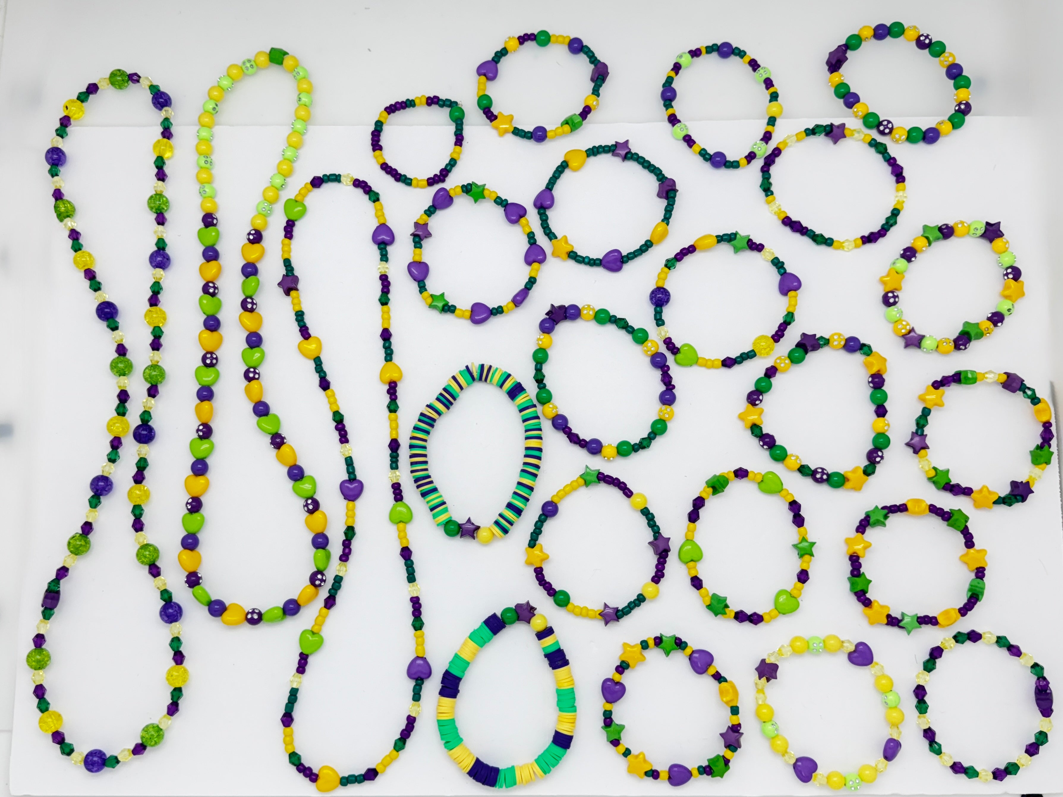 examples of some of the unique designs that can be made with the Mardi Gras bead box over white background. 