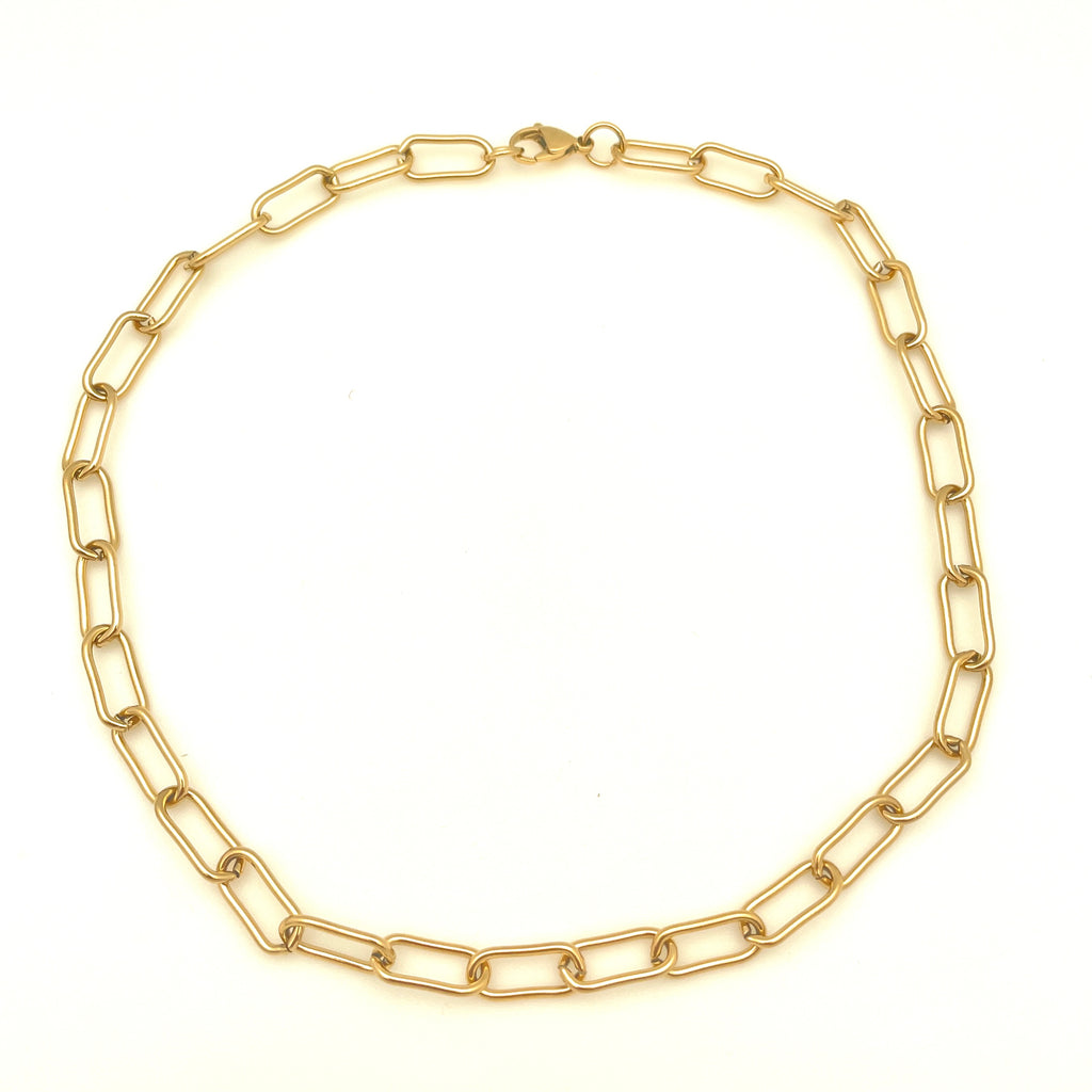 golden large round paperclip chain necklace with large lobster claw clasp in a circle over white background. 