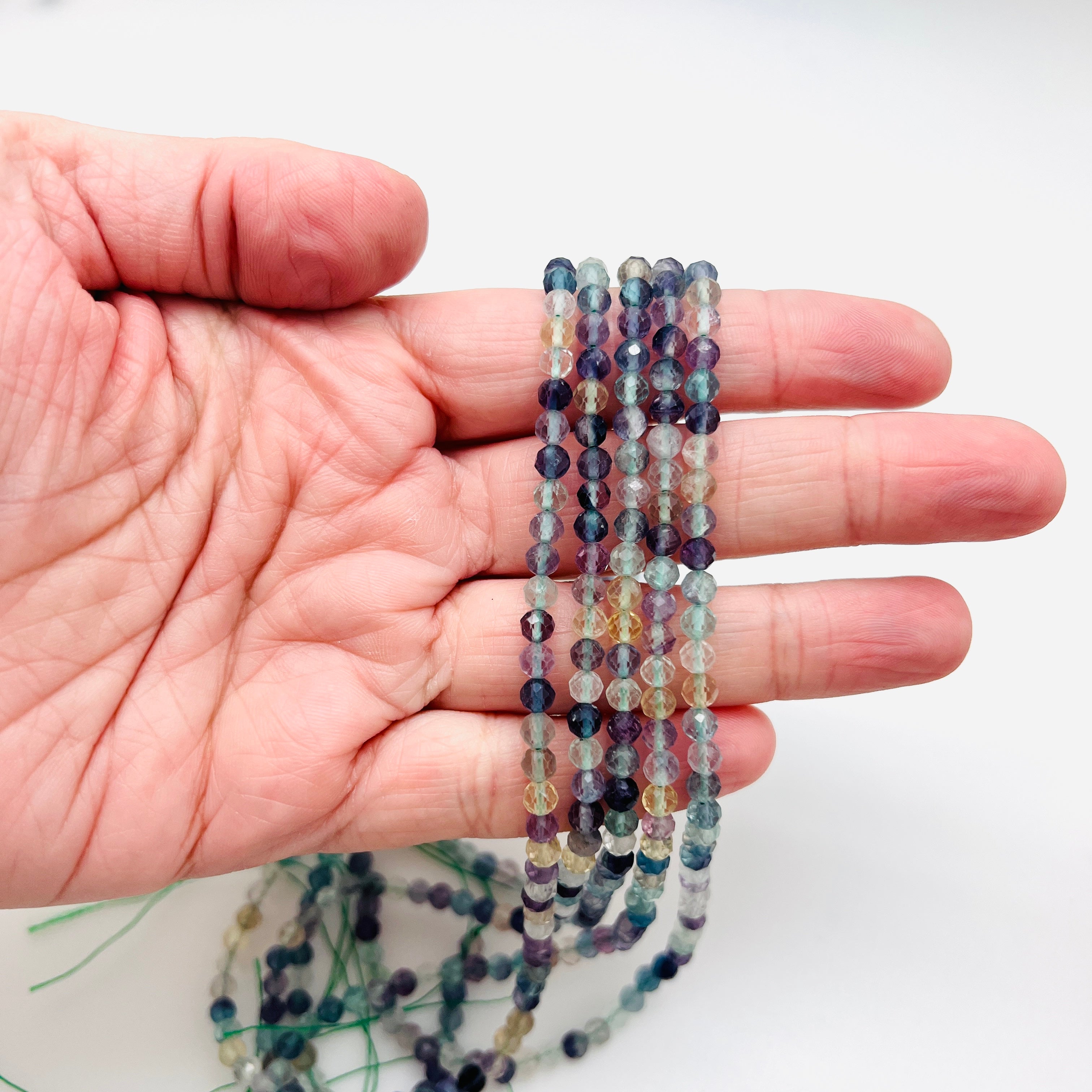 Rainbow Fluorite Faceted Rounds - 4mm