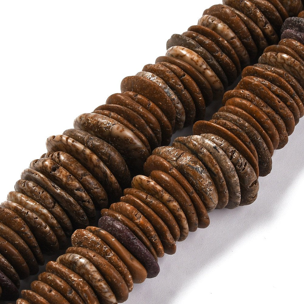 close-up of coconut brown dyed, synthetic turquoise, graduated bead strands over white surface. 