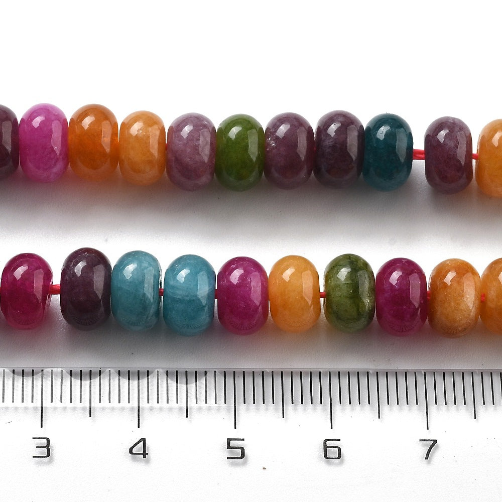 8mm mixed jewel tone smooth rondelle bead strands above clear ruler over white background. 