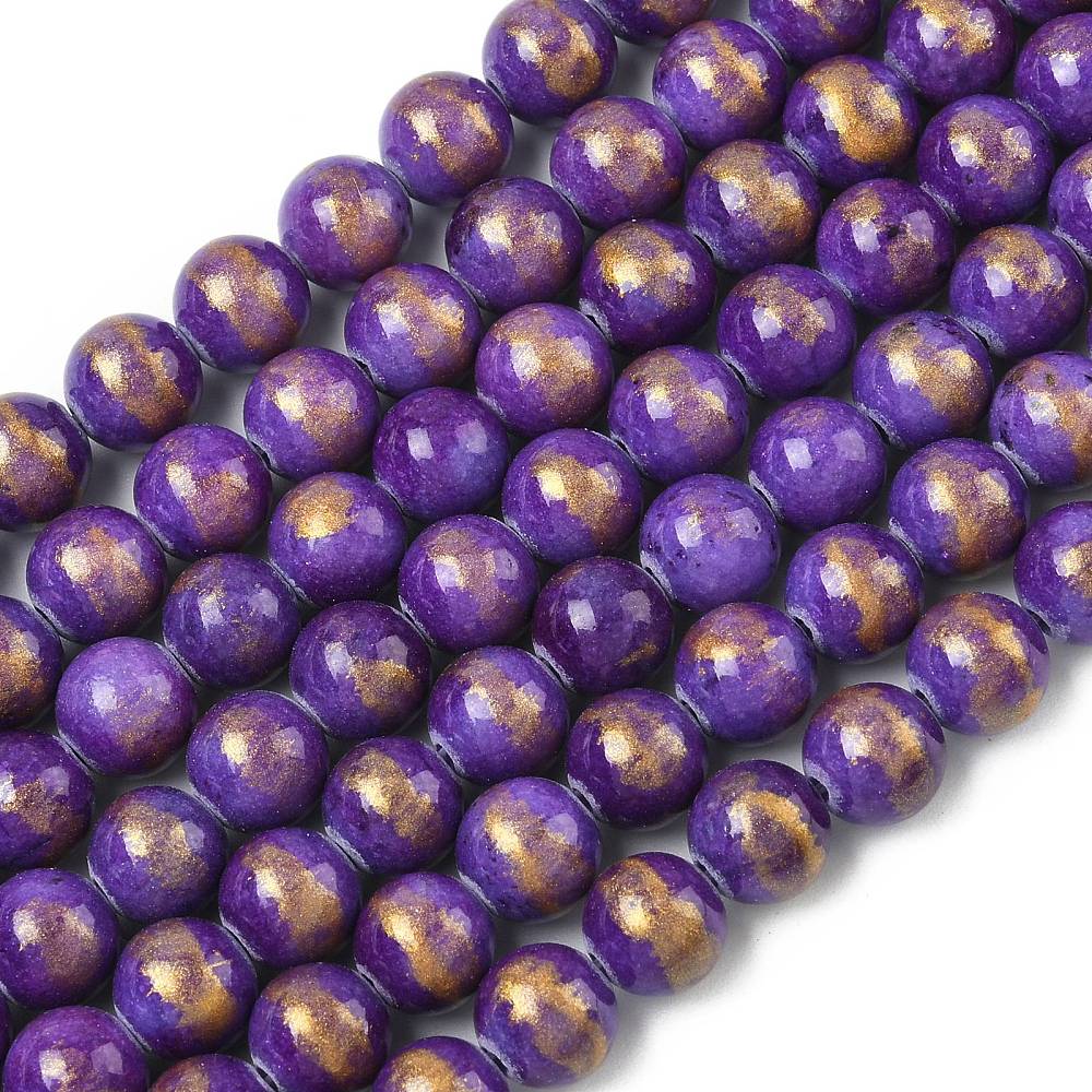 sections of smooth round and dyed purple jade bead strands with gold foil over a white surface. 