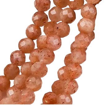 zoomed in sections of faceted round sunstone bead strands over white background.