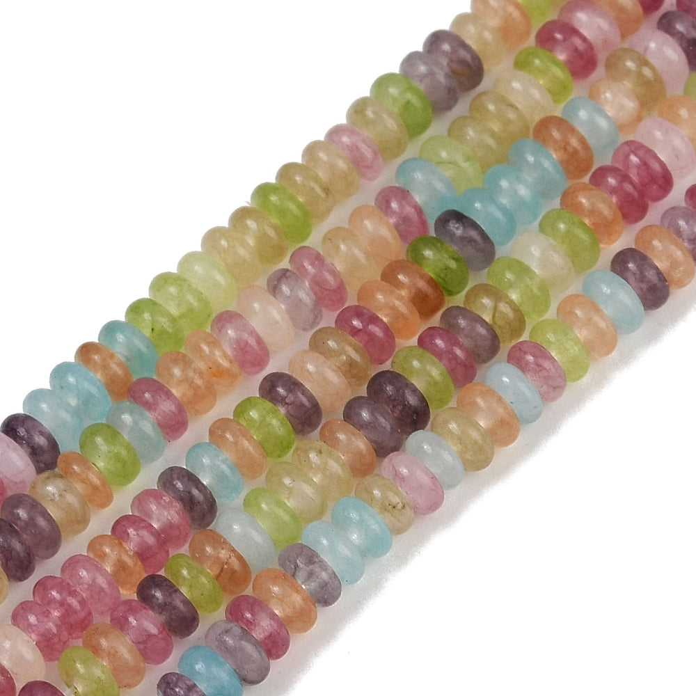 zoomed in sections of multicolor dyed jade smooth rondelle bead strands over white surface. 