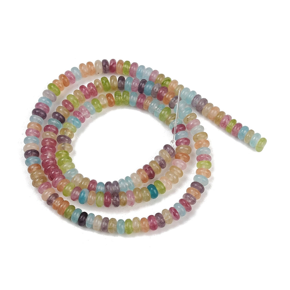 multicolor dyed jade smooth rondelle bead strand in spiral design over white surface. 
