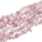multiple darker rose quartz chip strands over white background. 
