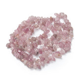 darker rose quartz chip strand in a swirl design over white background. 