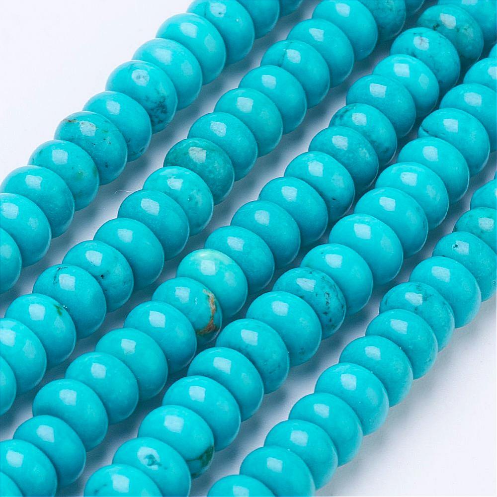 five strands of dyed turquoise magnesite rondelle beads over white background. 