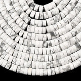 ten natural Howlite Heishi bead strands over black surface. 