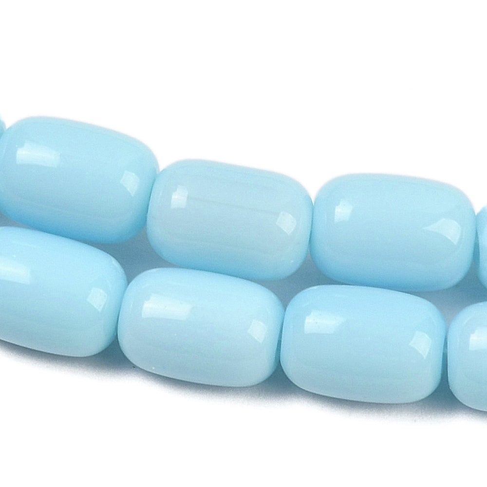 zoomed in sections of sky blue barrel bead strands over white surface.