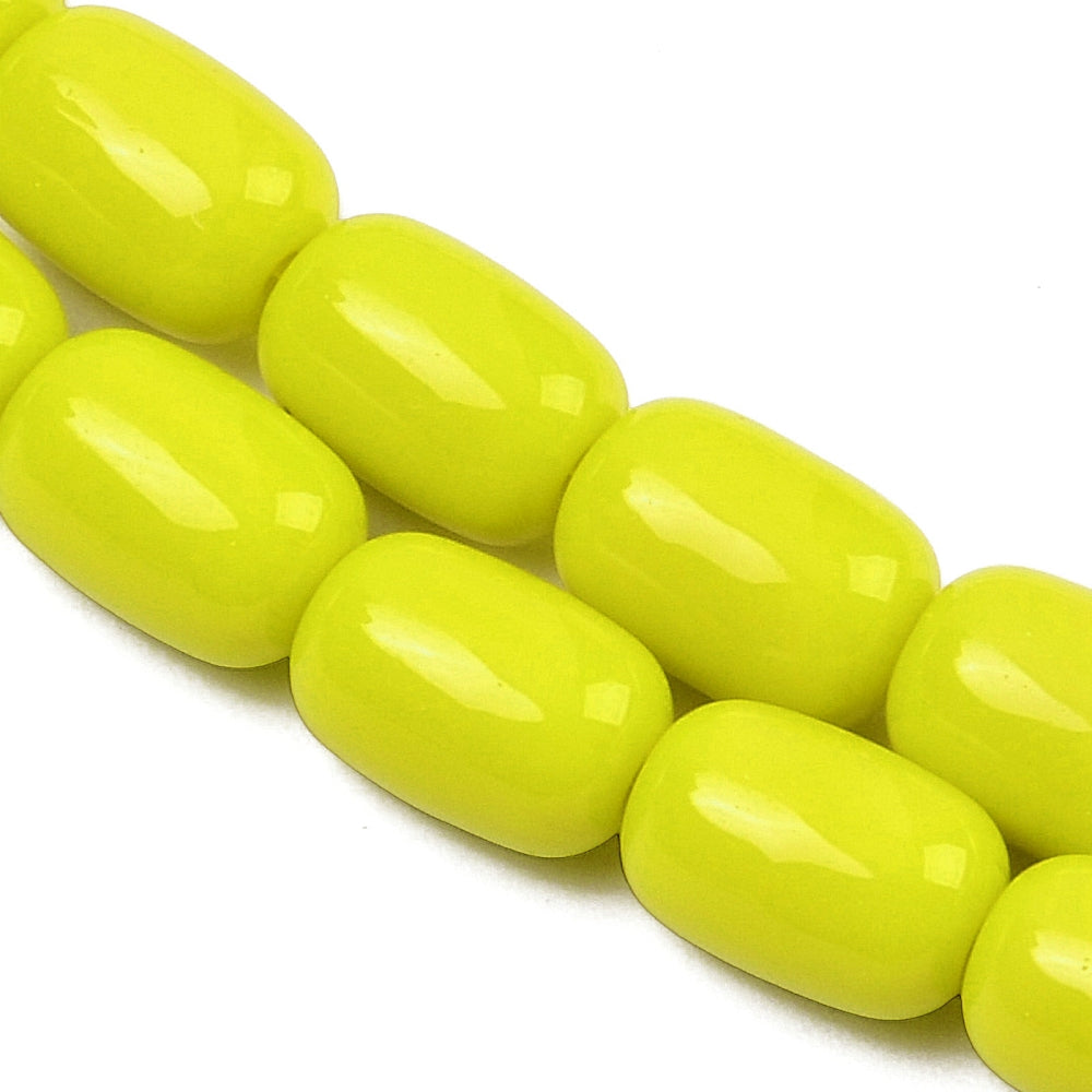 zoomed in sections of yellow barrel bead strands over white surface.