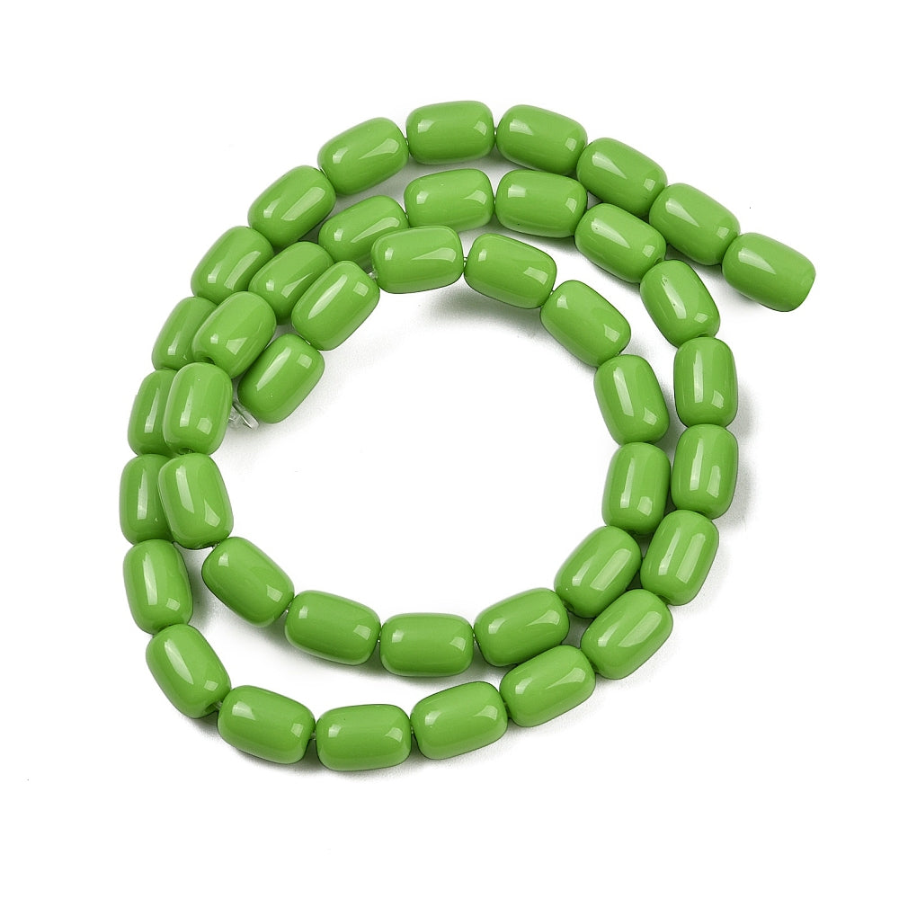 lime green glass barrel bead strand in swirl design over white surface. 