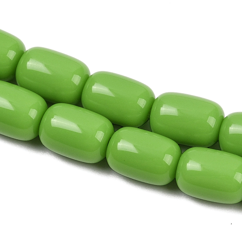 zoomed in sections of lime green barrel bead strands over white surface.