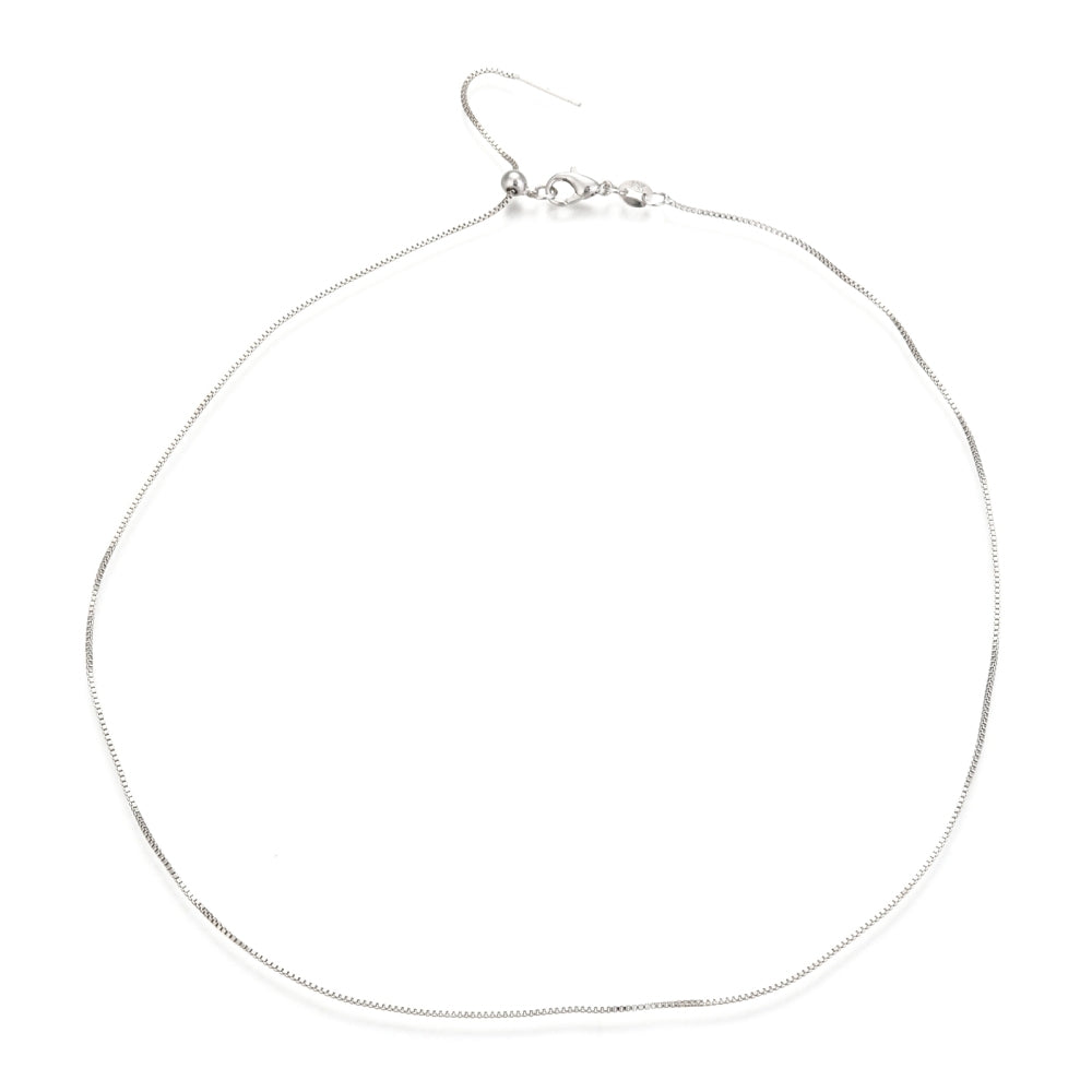 silver color adjustable box chain with lobster claw clasp on a white background.
