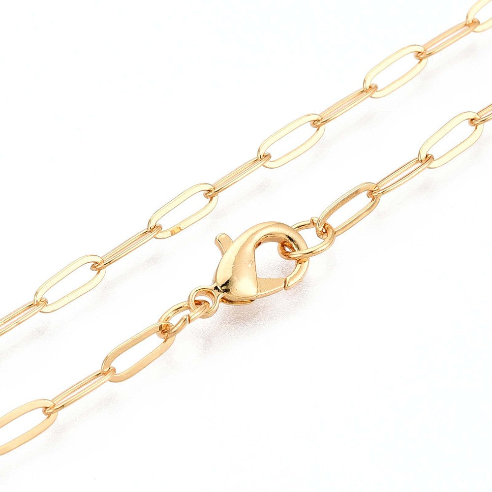 zoomed in sections of golden small paperclip link necklace with lobster claw clasp on white background.
