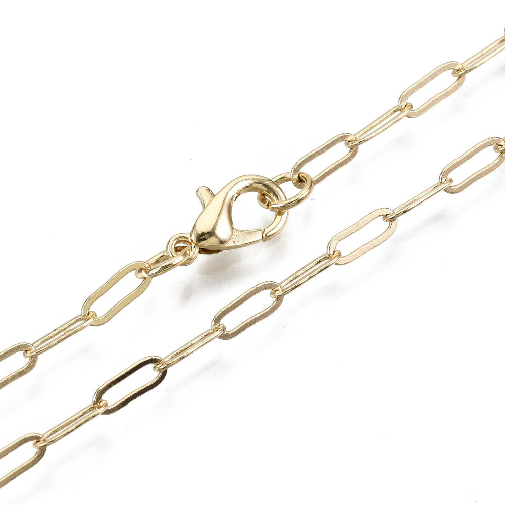 zoomed in sections of light golden small paperclip link necklace with lobster claw clasp on white background. 