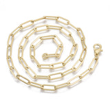 matte finished golden large paperclip link necklace with lobster claw clasp in a swirl pattern over white background. 