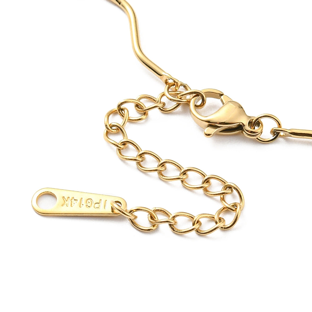 zoomed in section of golden wave bar link chain necklace with lobster claw clasp and extender chain over white surface. 