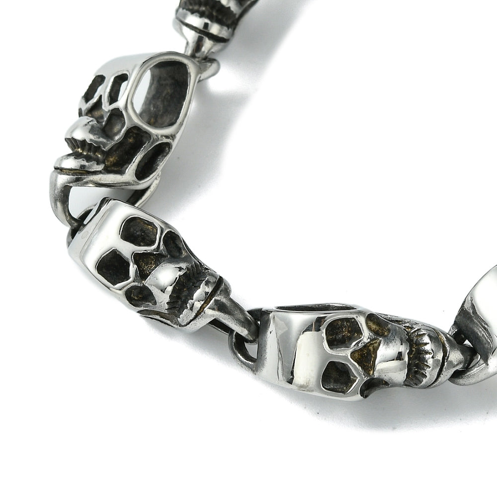 zoomed in section of the silver tone skull links on white background. 