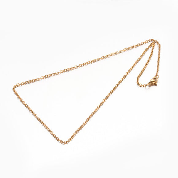 golden textured cable chain with lobster claw clasp on white background. 